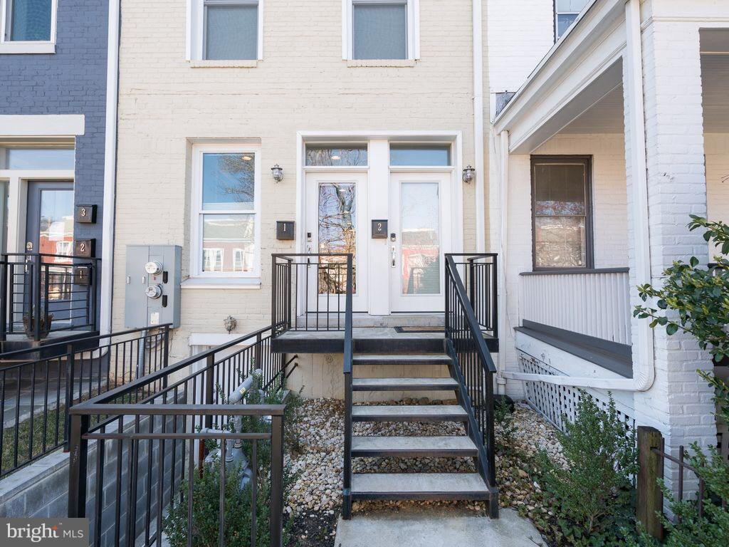 732 Girard Street Northwest, Unit 1 Washington, DC 20001 - Photo 5 of 10 a view of a house with wooden floor and stairs