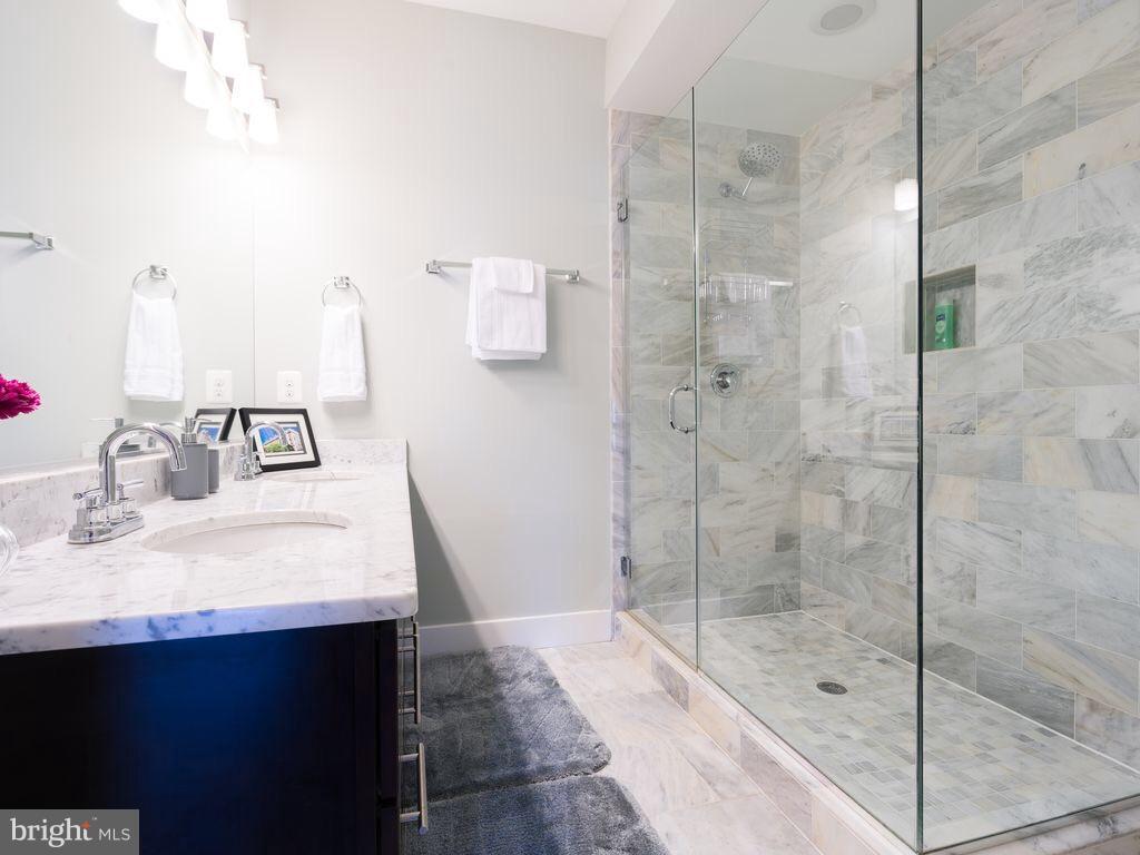 732 Girard Street Northwest, Unit 1 Washington, DC 20001 - Photo 8 of 10 a bathroom with a sink and a mirror