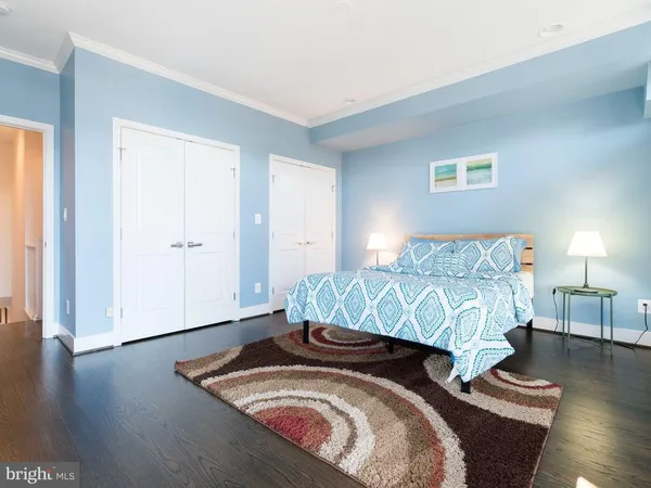 a bedroom with bed and window