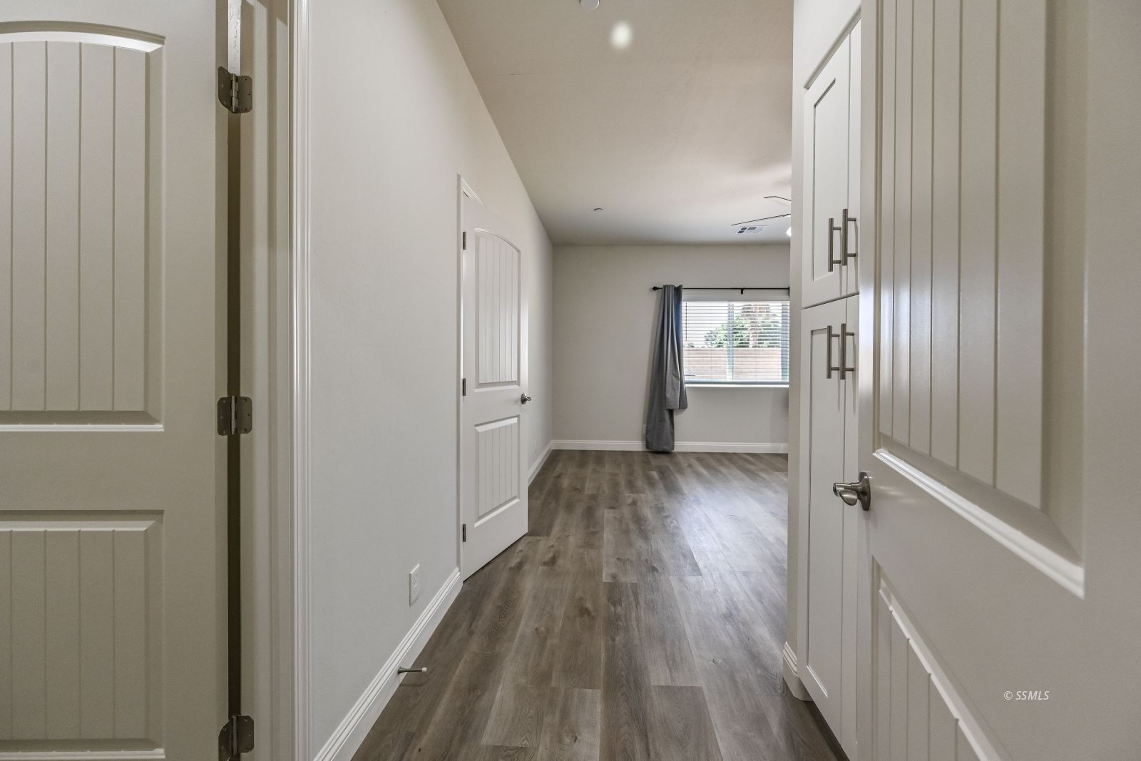 1031 West Church Avenue Ridgecrest, CA 93555 - Photo 24 of 49 a view of hallway with wooden floor