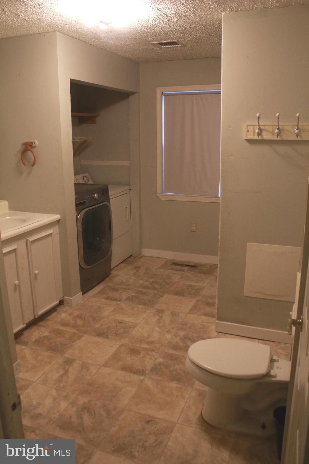 517 Grassdale Street Ranson, WV 25438 - Photo 21 of 26 Main bathroom/laundry