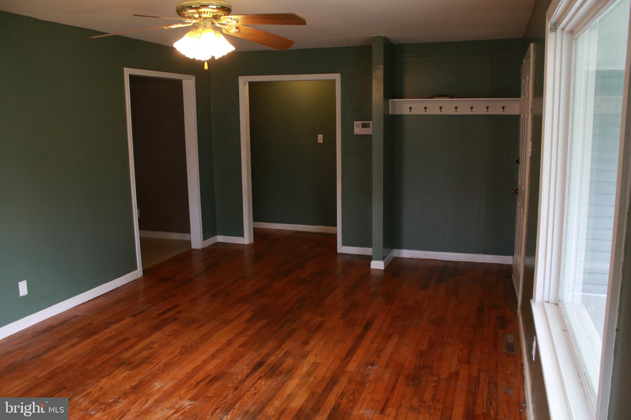 517 Grassdale Street Ranson, WV 25438 - Photo 6 of 26 Living room leading to dining room and hall