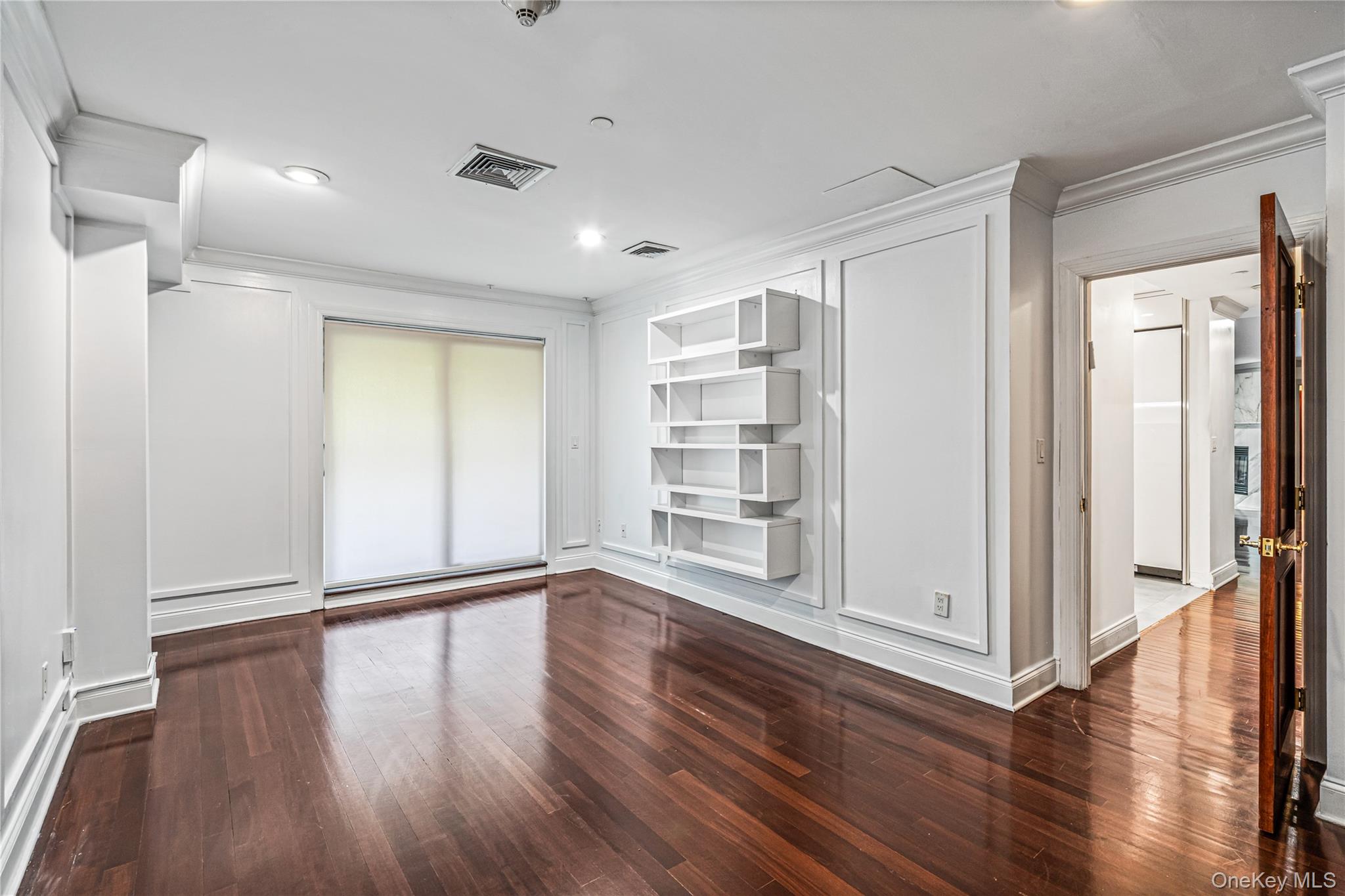 171 Great Neck Road, Unit 4R Great Neck, NY 11021 - Photo 12 of 27 a view of a livingroom with wooden floor