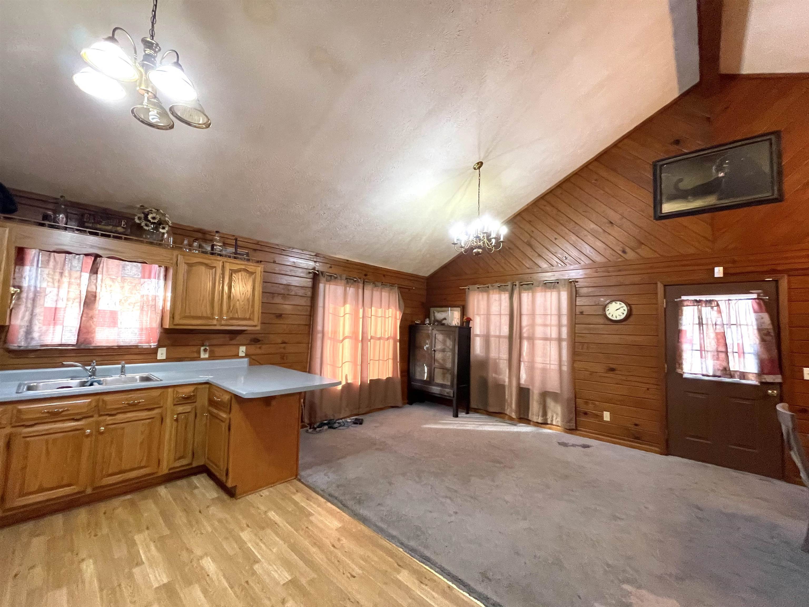 1110 Small Road Morris Chapel, TN 38361 - Photo 3 of 25 a large kitchen with a large counter top appliances and cabinets