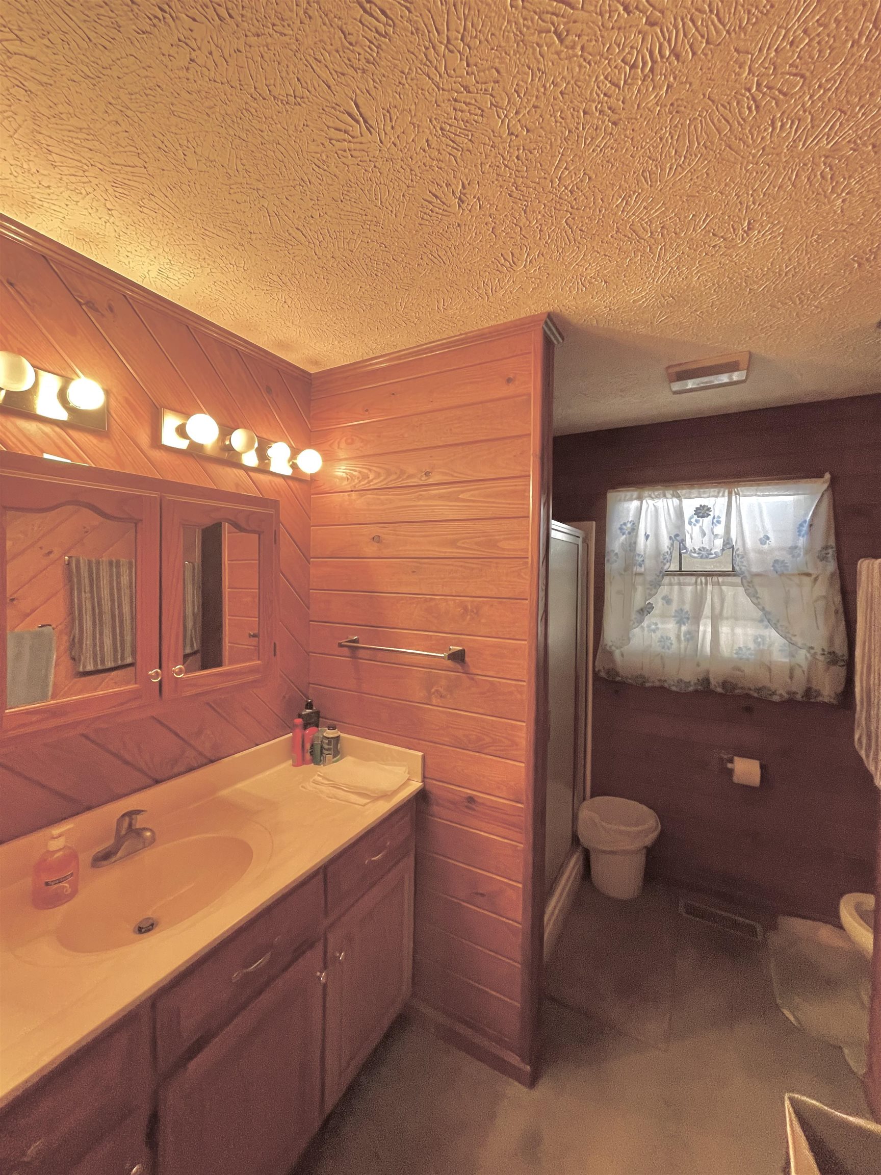 1110 Small Road Morris Chapel, TN 38361 - Photo 6 of 25 a bathroom with a sink and a mirror