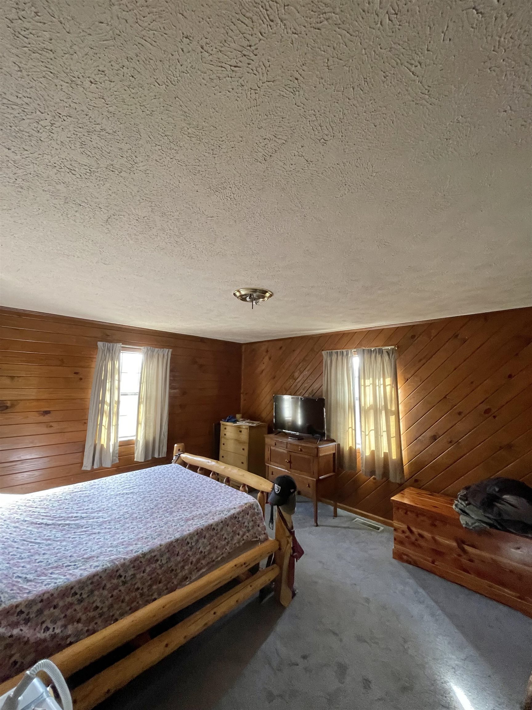 1110 Small Road Morris Chapel, TN 38361 - Photo 10 of 25 a spacious bedroom with a bed table and chair