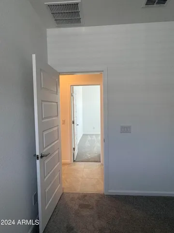 a view of room with closet and ceiling fan