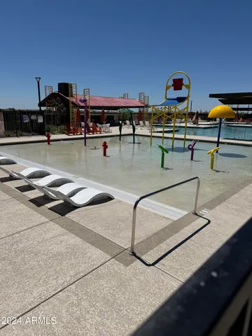 a view of swimming pool with outdoor seating