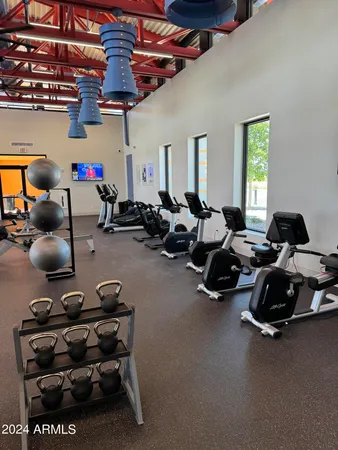 a kitchen with stainless steel appliances a sink and a refrigerator