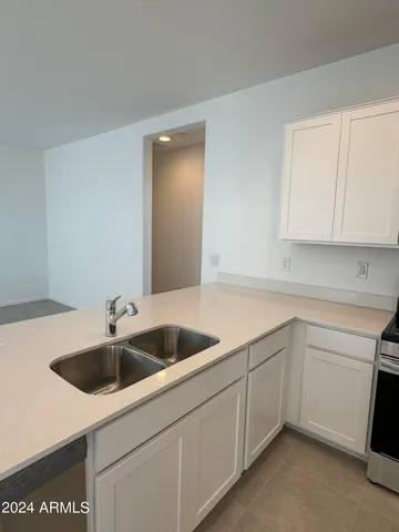 a kitchen with a sink and cabinets