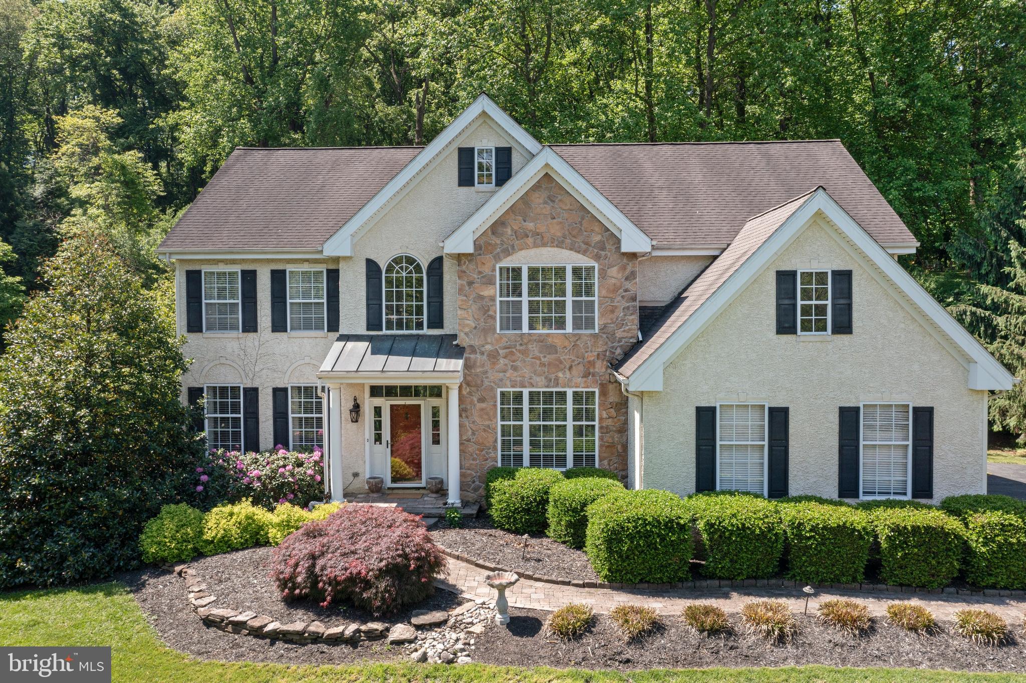 139 Watson Mill Road Landenberg, PA 19350 - Photo 5 of 73 a front view of a house with a yard and garage