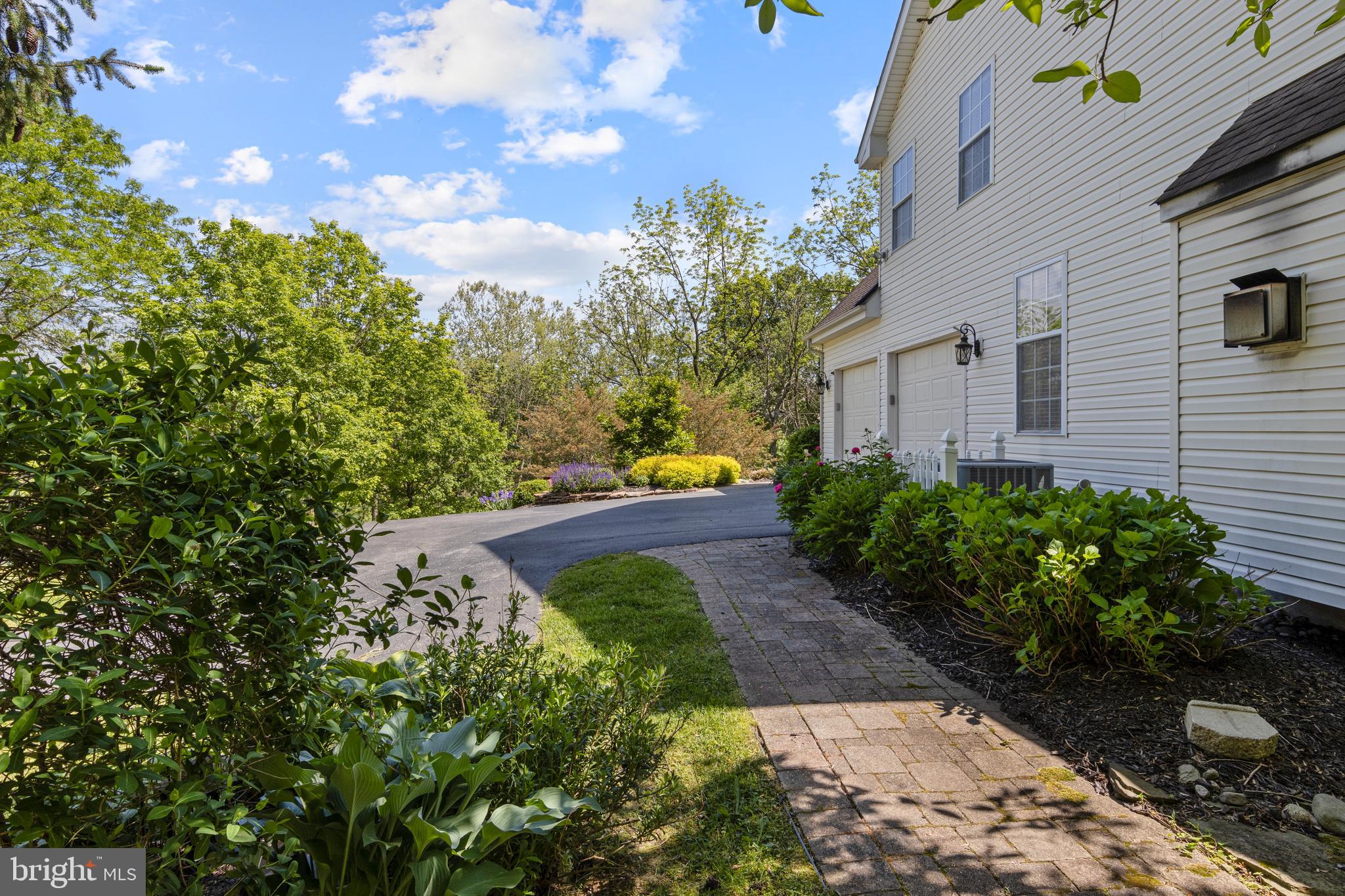 139 Watson Mill Road Landenberg, PA 19350 - Photo 67 of 73 a view of a yard with flower plants