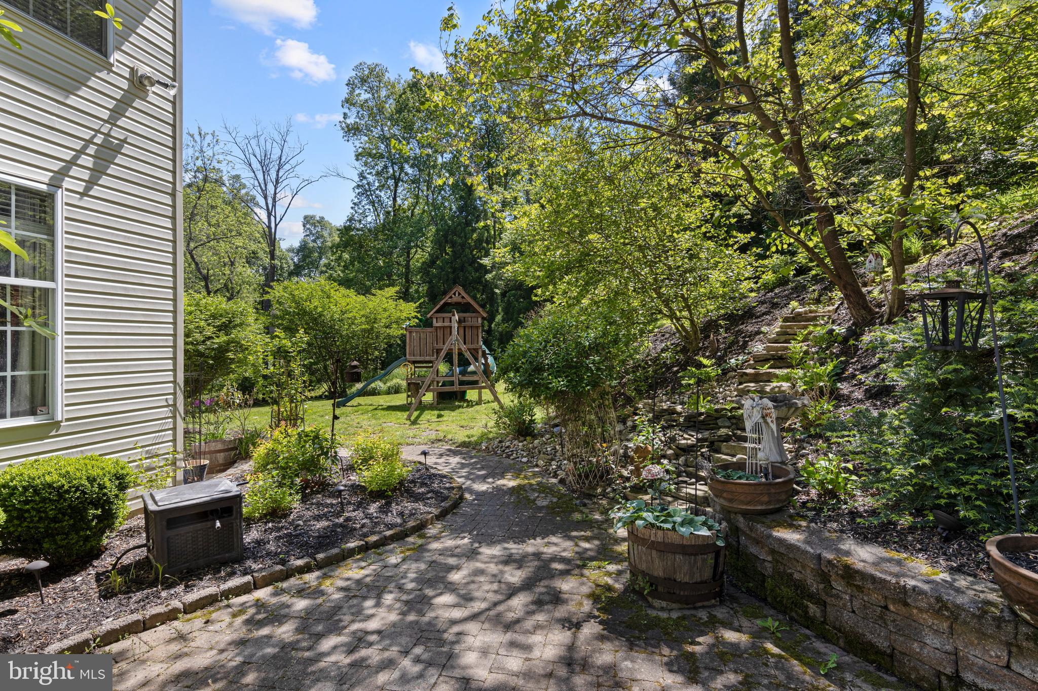 139 Watson Mill Road Landenberg, PA 19350 - Photo 69 of 73 a view of a backyard with plants and a garden
