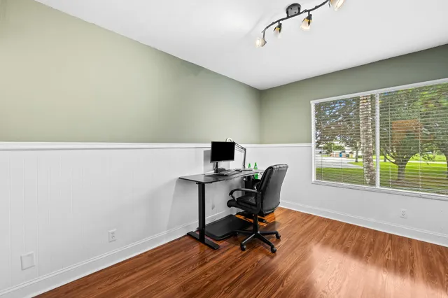 a workspace with furniture and a window