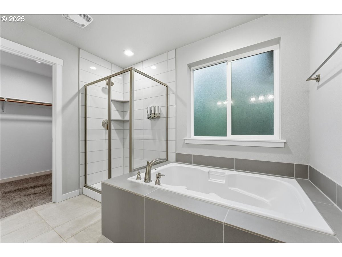 8565 Southwest 176th Avenue Beaverton, OR 97007 - Photo 25 of 39 a bathroom with a bathtub and a sink