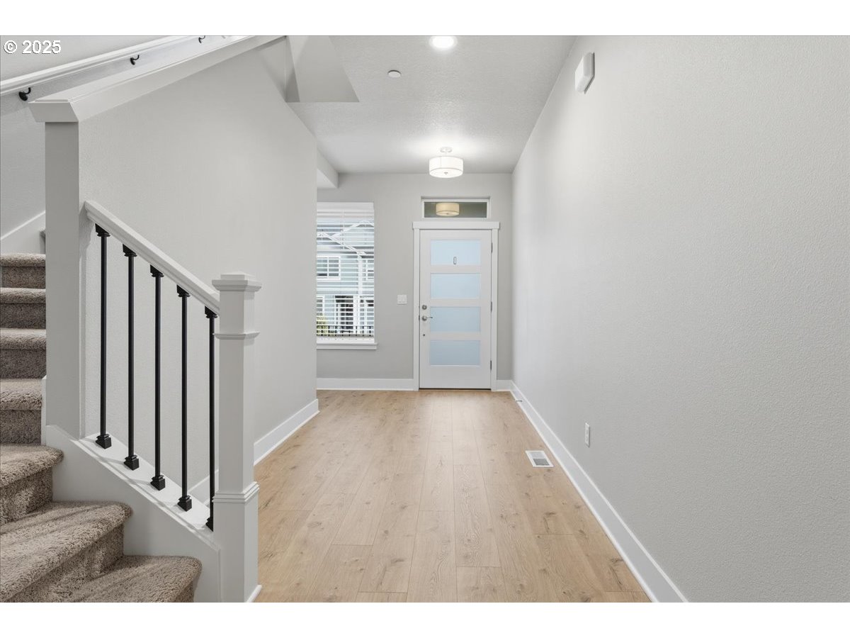 8565 Southwest 176th Avenue Beaverton, OR 97007 - Photo 3 of 39 a view interior of a house with wooden floor