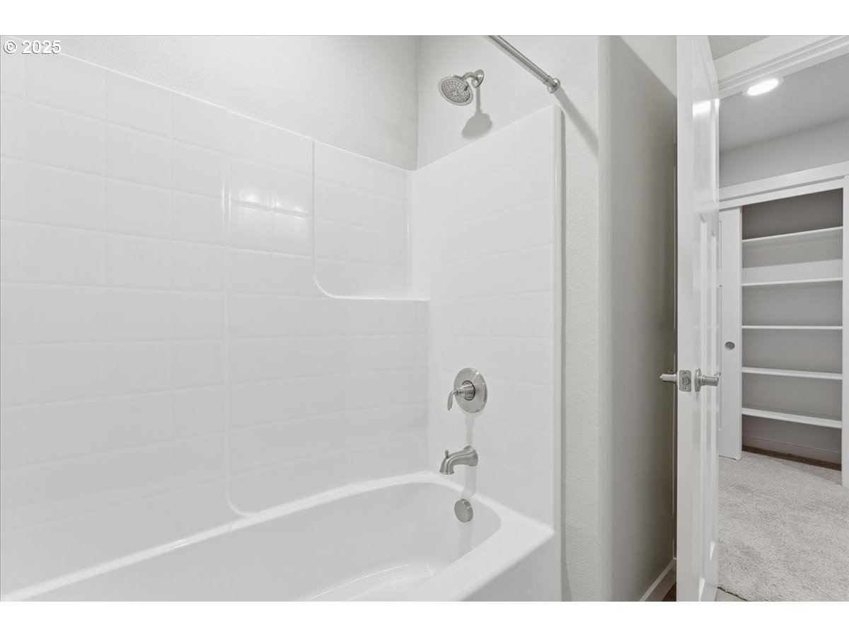 8565 Southwest 176th Avenue Beaverton, OR 97007 - Photo 33 of 39 a bathroom with a bathtub and a shower