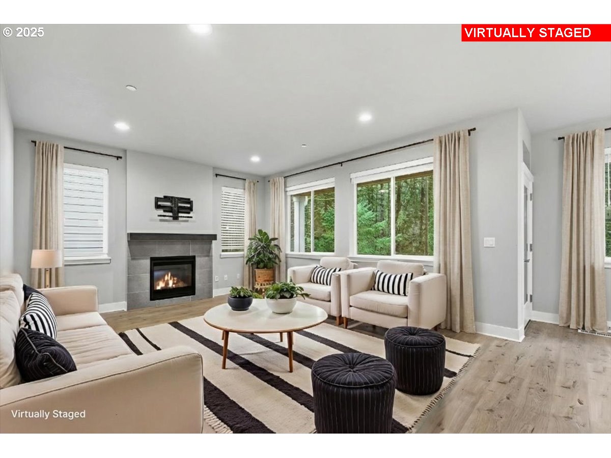 8565 Southwest 176th Avenue Beaverton, OR 97007 - Photo 10 of 39 a living room with furniture and a fireplace
