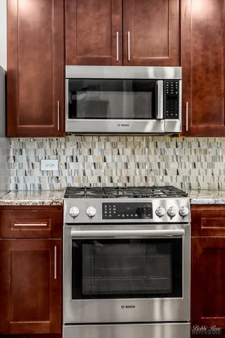 a view of a livingroom with furniture and a fireplace