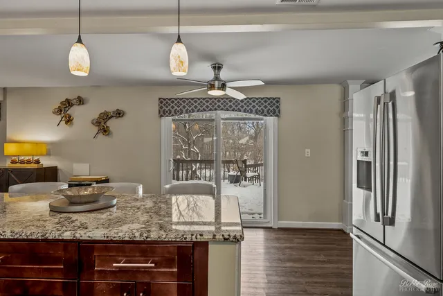 a view of a vase of flowers sitting on a table