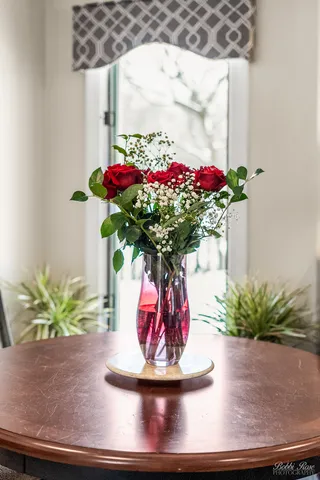 a kitchen with a sink a refrigerator and cabinets