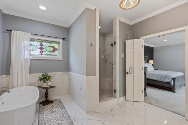 a en suite bathroom with a tub and shower
