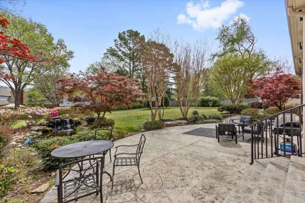 a view of a table and chairs in patio
