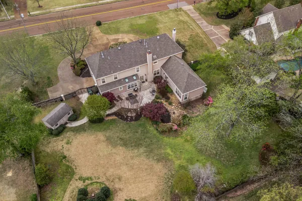 an aerial view of a house with a garden
