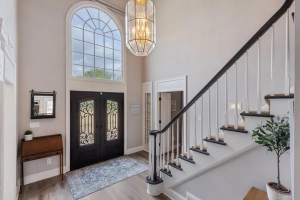 a view of hall way with furniture