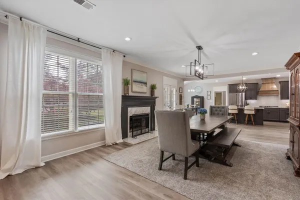 a view of a livingroom with furniture and a window