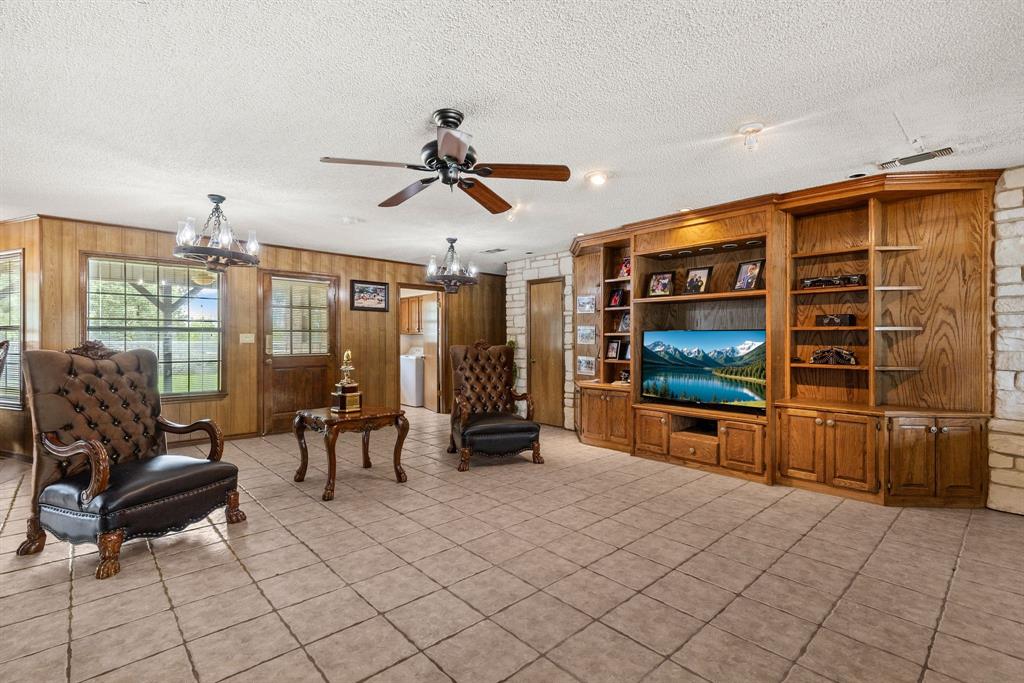 4509 Diamond D Road Lone Oak, TX 75453 - Photo 32 of 36 a living room with furniture and a flat screen tv
