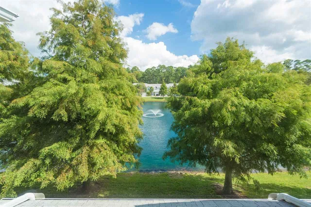 a bathroom with a granite countertop sink mirror and shower