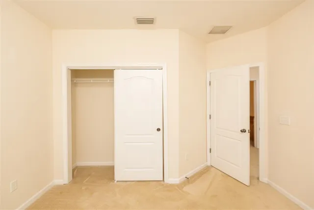 a bathroom with a granite countertop sink a mirror and a toilet