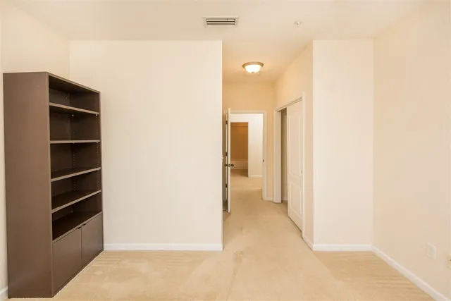 a bathroom with a granite countertop sink a toilet and a shower