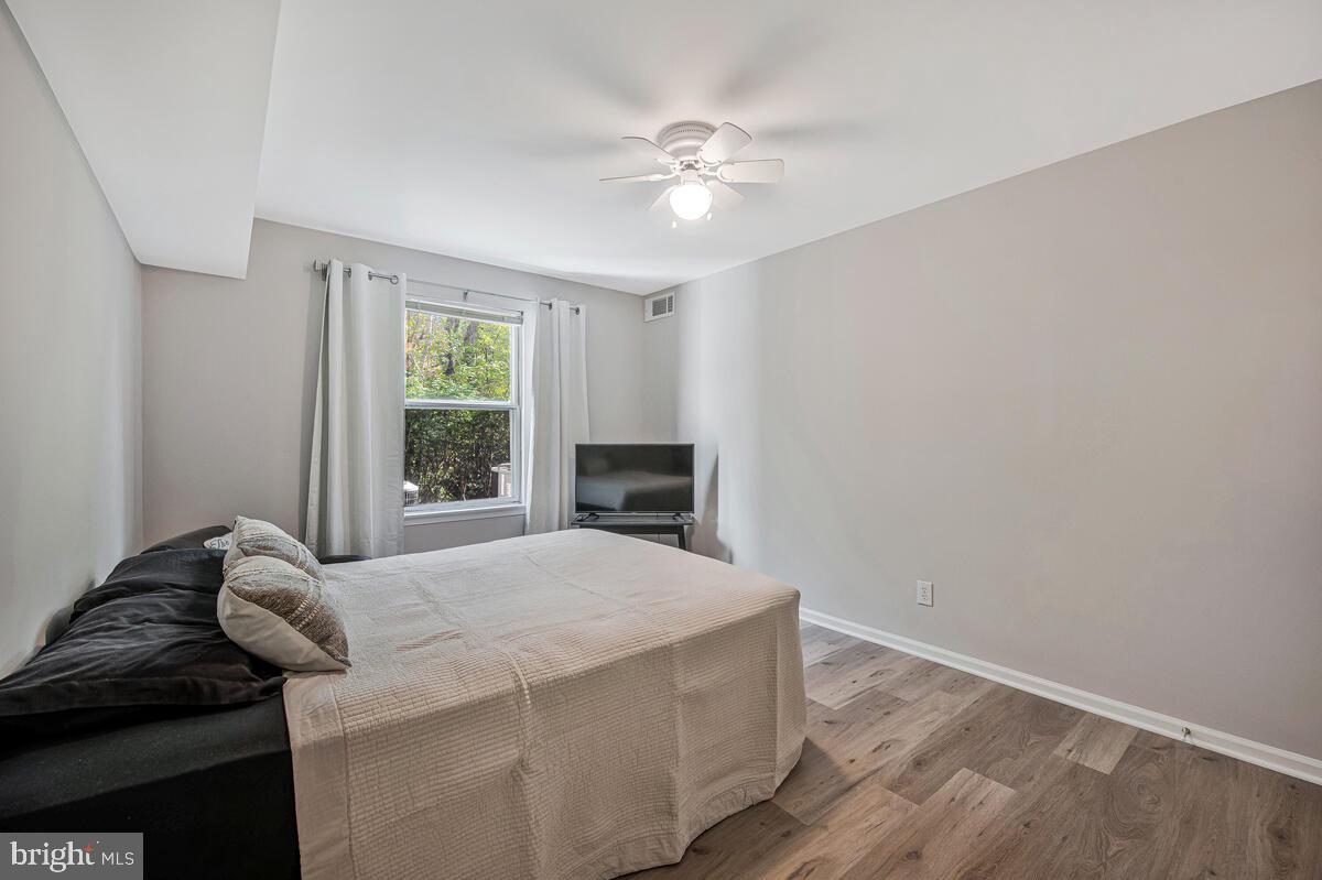 20334 Beaconfield Terrace, Unit 2 Germantown, MD 20874 - Photo 13 of 24 a bedroom with a bed and a window
