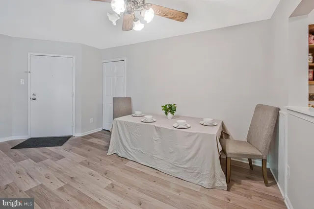 a bed sitting in a spacious bedroom next to a chair