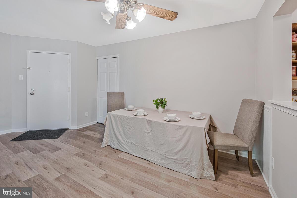 20334 Beaconfield Terrace, Unit 2 Germantown, MD 20874 - Photo 20 of 24 a bed sitting in a spacious bedroom next to a chair