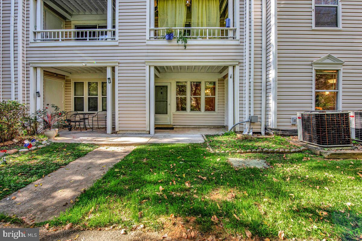 20334 Beaconfield Terrace, Unit 2 Germantown, MD 20874 - Photo 21 of 24 a front view of a house with garden