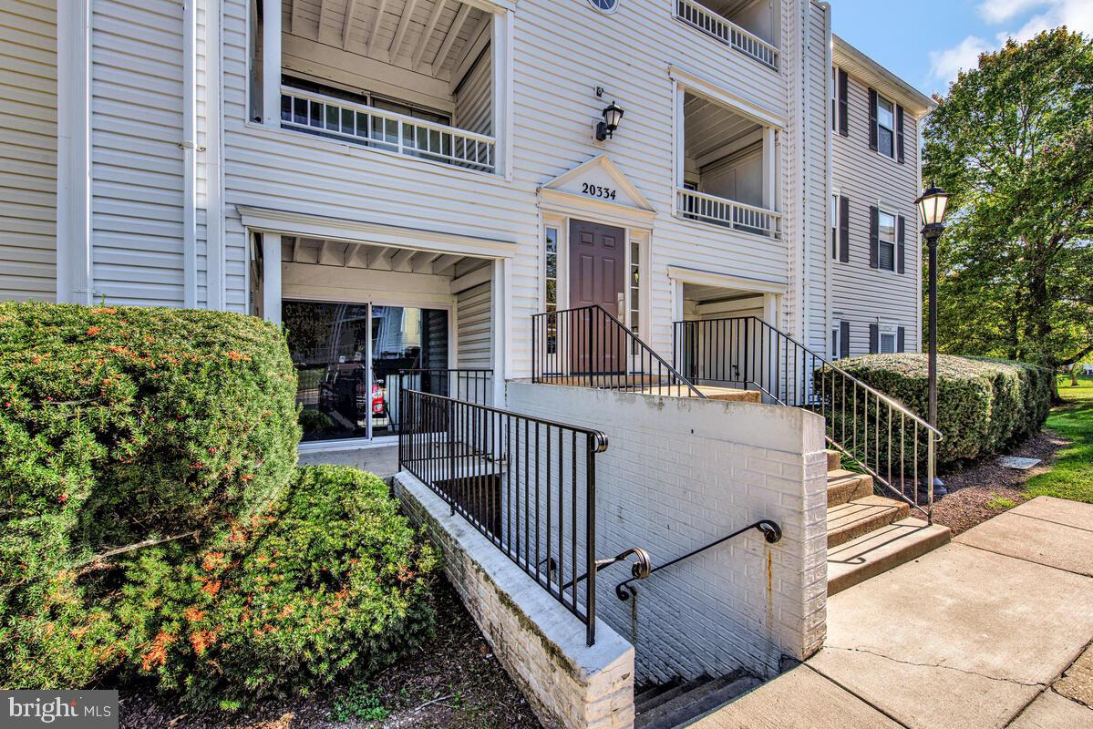 20334 Beaconfield Terrace, Unit 2 Germantown, MD 20874 - Photo 3 of 24 front view of a house with a porch