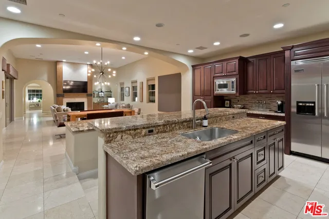a dining table chair and kitchen view