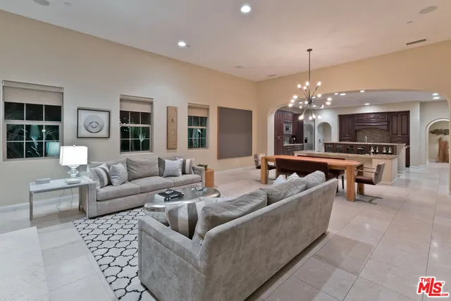 a living room with fireplace furniture and a fireplace