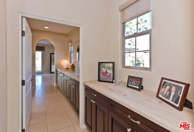 a spacious bedroom with a bed and a cabinets