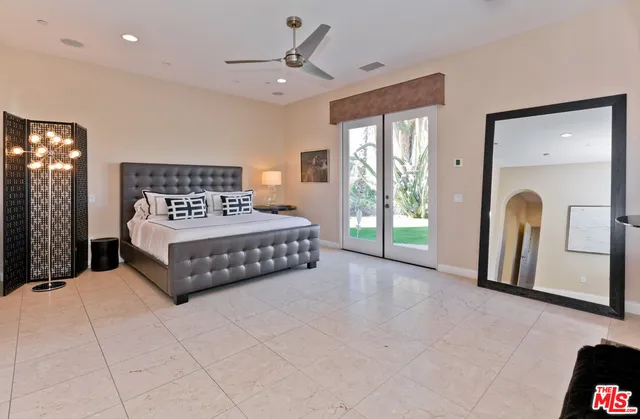 a bathroom with a granite countertop sink mirror and shower