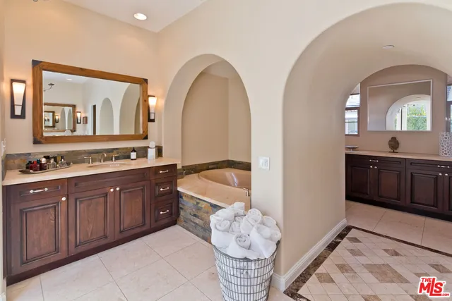 a spacious bedroom with a bed and a table