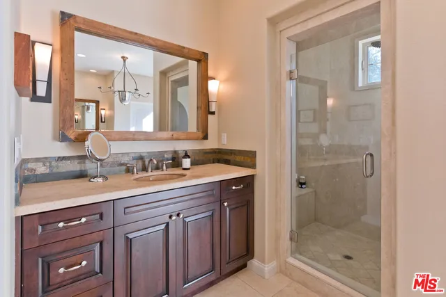 a spacious bedroom with a bed and window