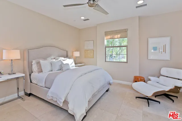 a view of a livingroom with furniture wooden floor and window