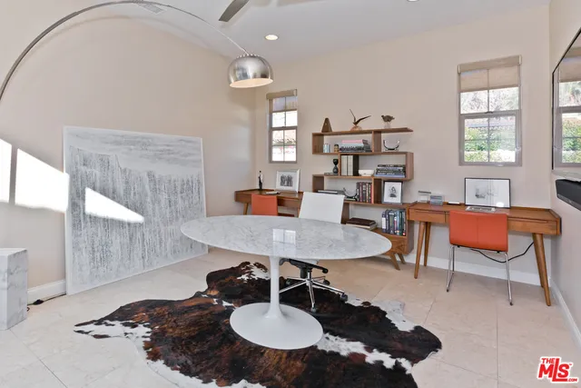 a bathroom with a granite countertop toilet sink mirror and shower