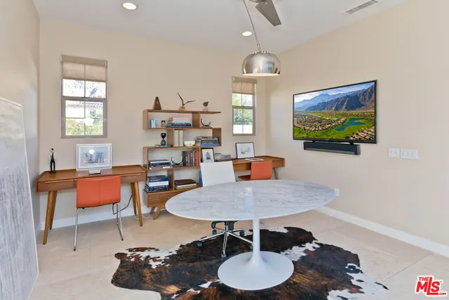 a bedroom with a large bed and a large window