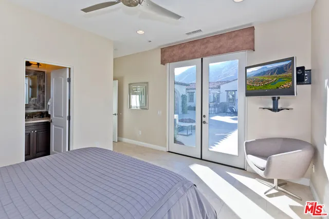 a view of a dining room with furniture and a chandelier