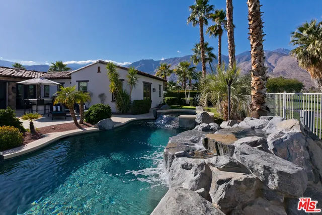 a view of swimming pool with outdoor seating